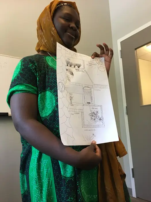 a woman displaying a drawing